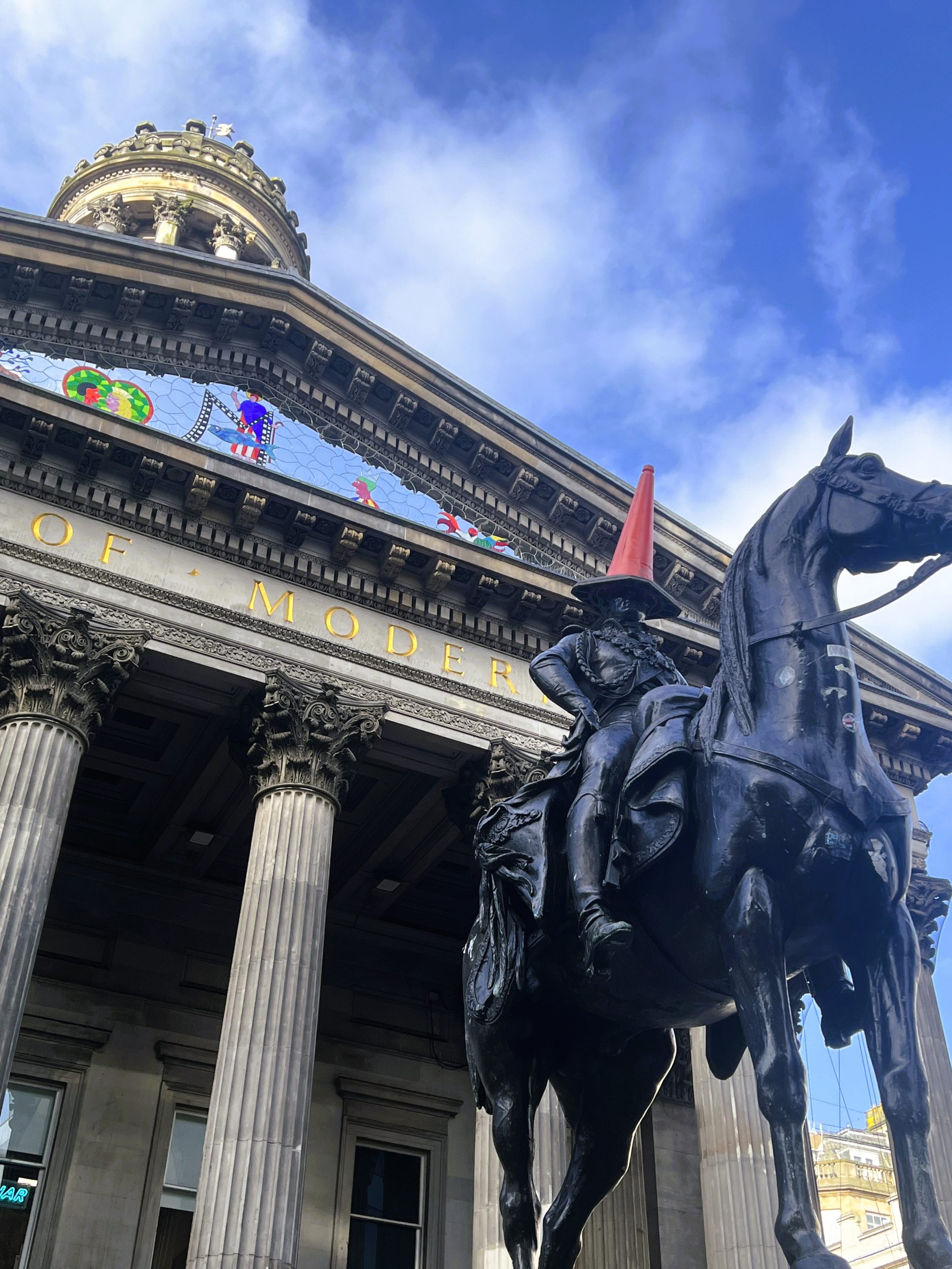 The equestrian statue of Arthur Wellesley, 1st Duke of Wellington located outside the Royal Exchange, now known as the Gallery of Modern Art, Glasgow, Scotland with his wee orange traffic cone on.Credit: N C Sandilands